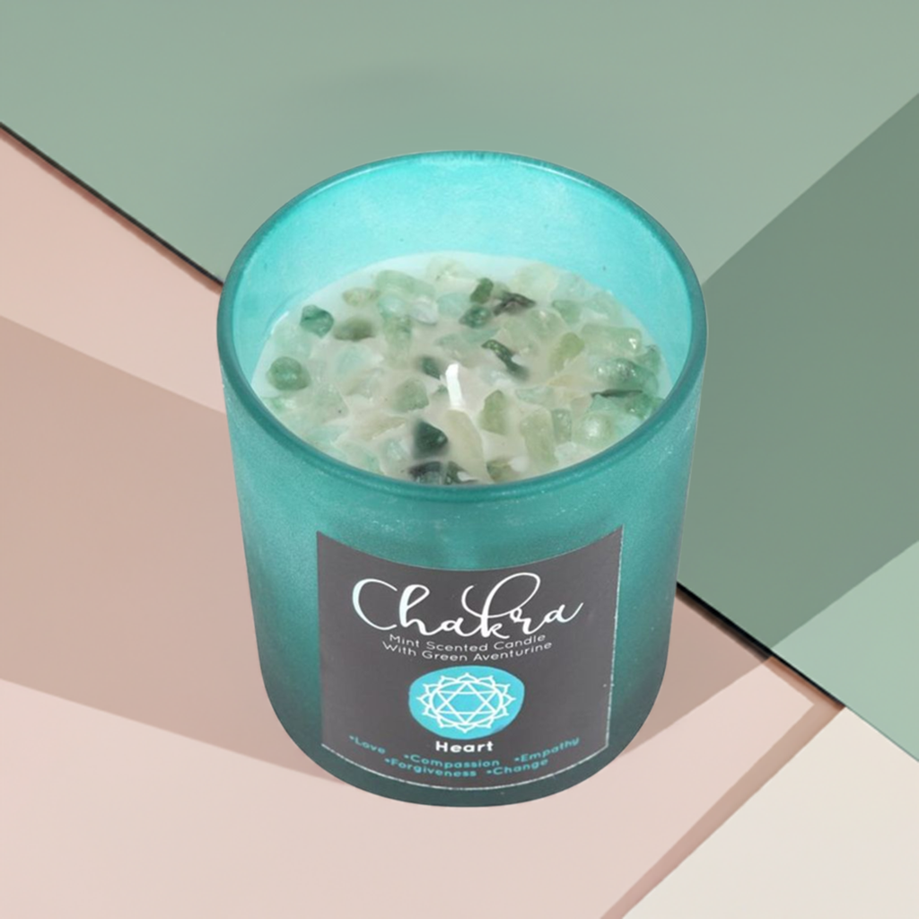 Heart Chakra Mint Crystal Chip Candle, a soothing soy wax candle infused with refreshing mint fragrance and natural crystal chips. Designed to align with the heart chakra, this candle promotes love, compassion, and emotional healing. Perfect for meditation, energy work, and creating a calming, heart-opening atmosphere in your space.