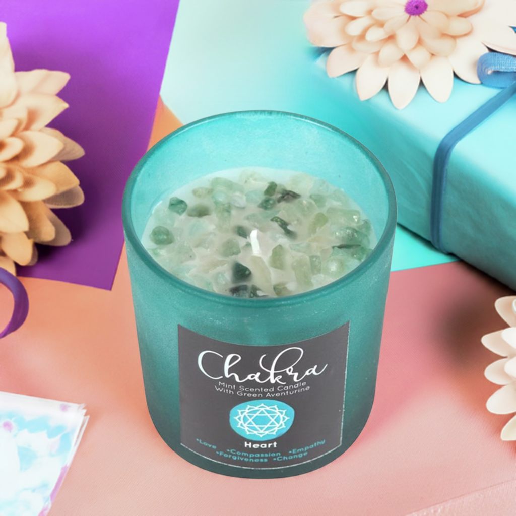 Heart Chakra Mint Crystal Chip Candle, a soothing soy wax candle infused with refreshing mint fragrance and natural crystal chips. Designed to align with the heart chakra, this candle promotes love, compassion, and emotional healing. Perfect for meditation, energy work, and creating a calming, heart-opening atmosphere in your space.